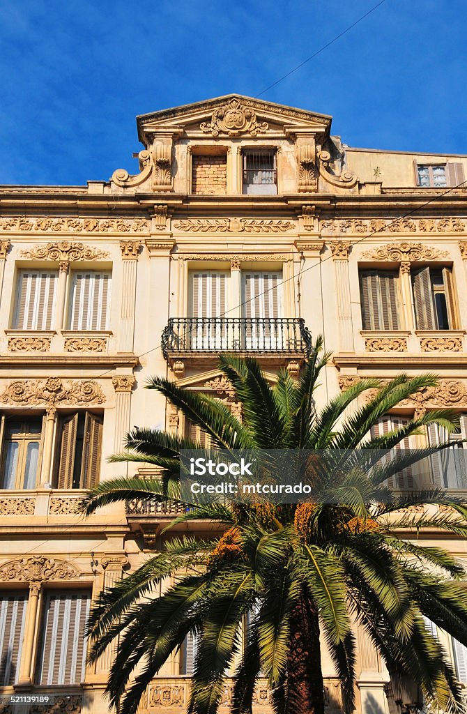 Oran, Algeria: colonial façade Oran, Algeria: ornate 19th century colonial façade and palm tree - boulevard Soummam - photo by M.Torres Algeria Stock Photo