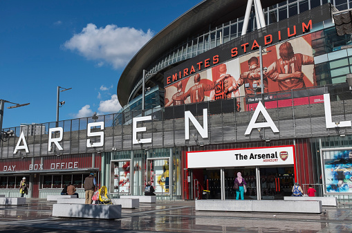 London, UK - September 24, 2014 : Emirates Stadium, North London, home of English Premier League team Arsenal Football Club. View shows the south entrance and club shop.