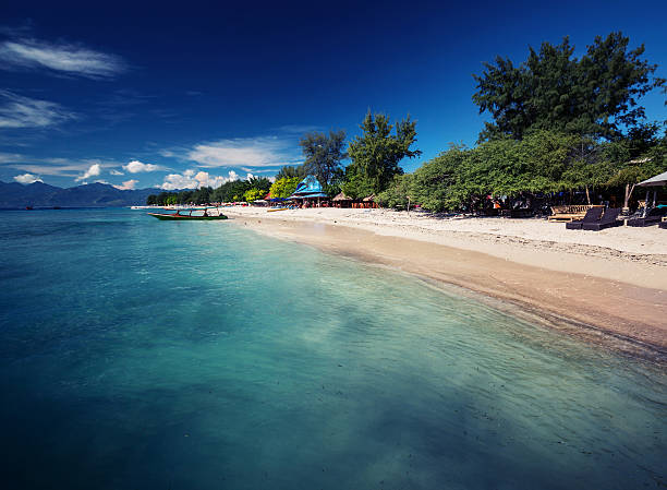 Indonesian Tropical sea with turquoise water and green trees. Gili Trawangan, Indonesia gili trawangan stock pictures, royalty-free photos & images