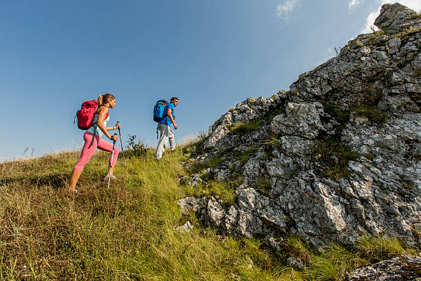 istock Young couple hiking on the mountain 521151449
