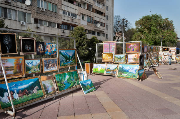 Almaty, Kazakhstan - May 6, 2014: Pedestrian zone street Jibek Joly. Arbat Shopping street is a nice place to visit when visiting Almaty, as it's filled with artists selling their works, People walk on the street