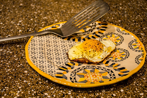 Fresh Egg Sunny Side up on a Marbled Counter