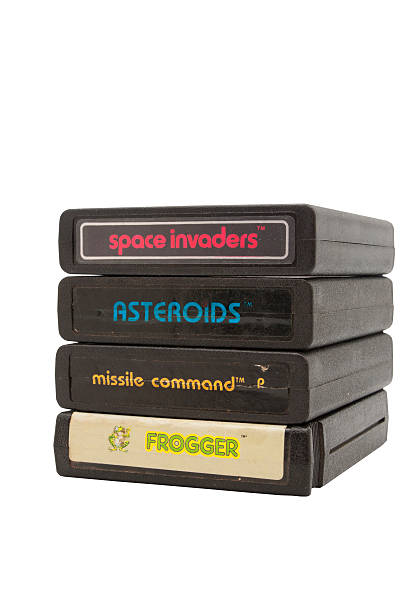 Atari 2600 Game Cartridges Adelaide, Australia - October 27, 2014: A Studio shot of a stack of Atari 2600  Game Cartridges. Originally available in the 1980's is now considered a collectors item. brand name games console stock pictures, royalty-free photos & images