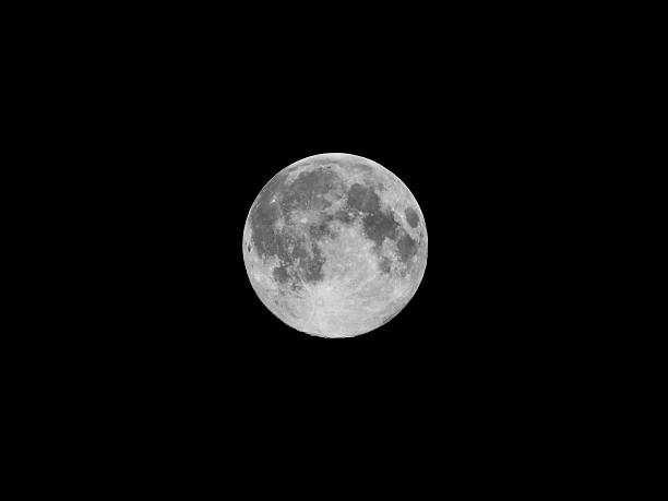 istock Full moon over dark black sky at night 521180129