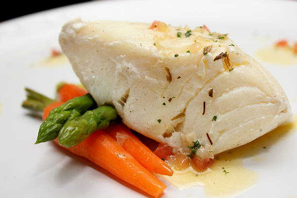 istock grilled Pangasius fish steak, isolated on a white plate 521180547