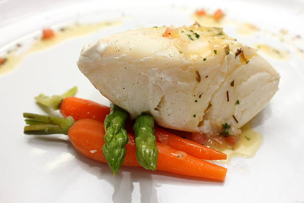 istock grilled Pangasius fish steak, isolated on a white plate 521180549