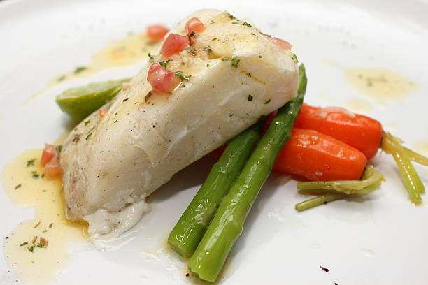 istock grilled Pangasius fish steak, isolated on a white plate 521180553