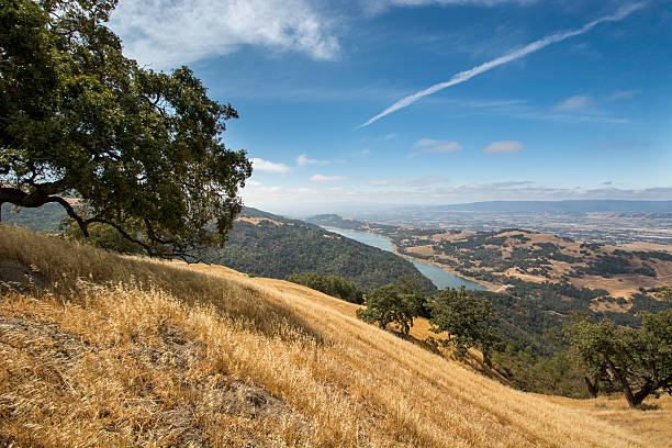 view from the hills ranchlands of eastern Santa Clara County, In the distance on the valley floor the developments of Morgan Hill and Gilroy can be seen foothills photos stock pictures, royalty-free photos & images