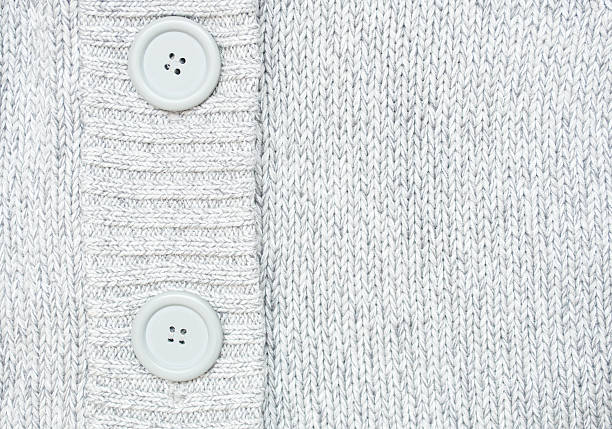 istock background with Knitted grey sweater with buttons  Knitted woole 521183599