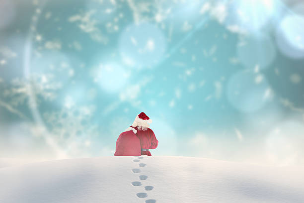istock Composite image of santa walking in the snow 521183641