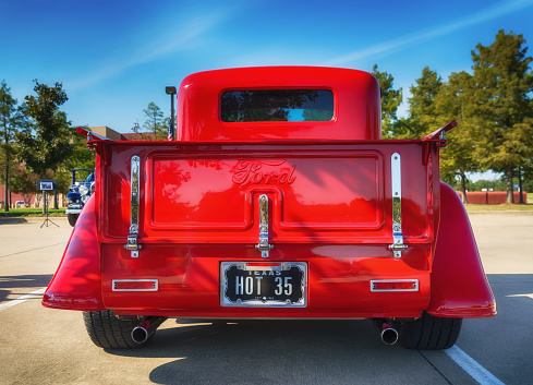 Westlake, Texas, USA - October 18, 2014: A red 1935 Ford pickup truck is on display at the 4th Annual Westlake Classic Car Show. Rear view.