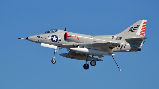 Jacksonville, USA - October 26, 2014: A Vietnam-era Navy A-4 Skyhawk attack jet uses its tailhook to preapre for an aircraft carrier landing.