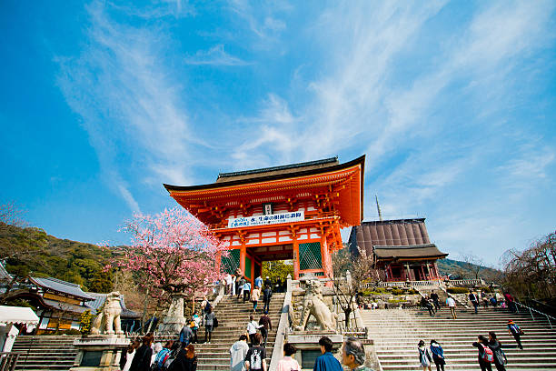 Kyoto, Japan - March 24, 2014: People at the Niomon gate in Kiyomizu-dera Temple. It is located in 1-294 Kiyomizu Higashiyama-ku, Kyoto, Japan. This temple was added to the list of UNESCO world heritage sites in 1994.
