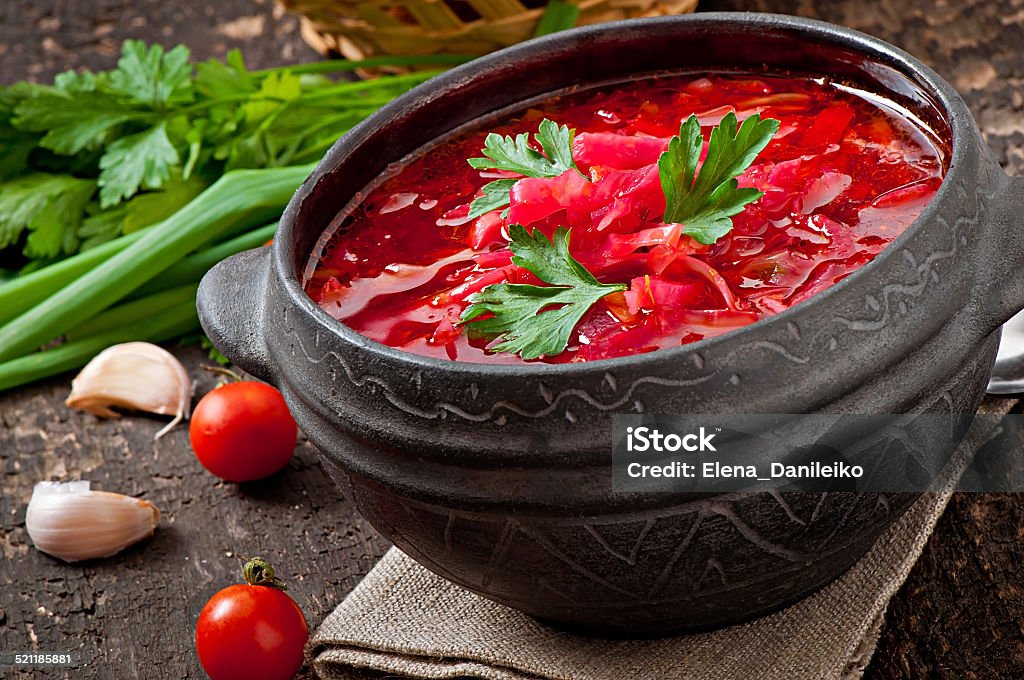 Traditional Ukrainian Russian vegetable borsch Traditional Ukrainian Russian vegetable borsch on the old wooden background Appetizer Stock Photo