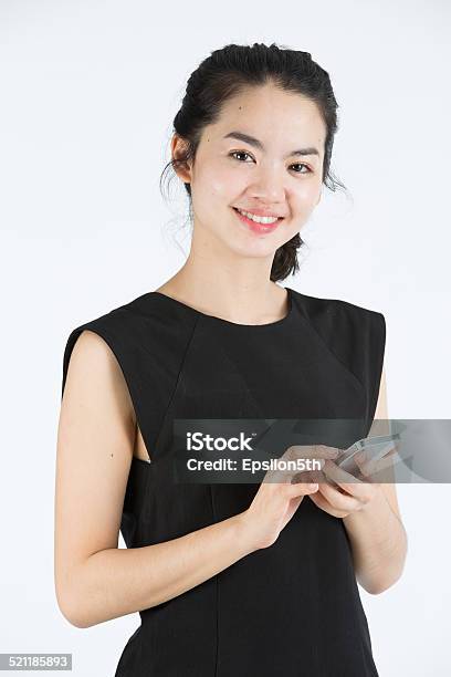 Asian Lady Using A Mobilephone Stock Photo - Download Image Now - Adult, Adults Only, Asian and Indian Ethnicities