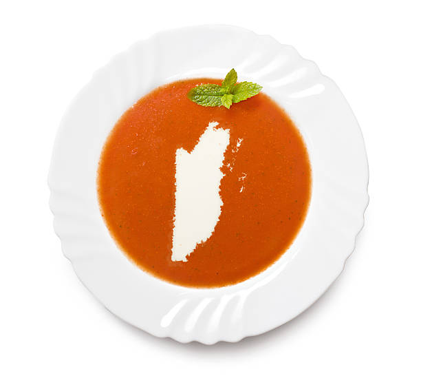 istock Plate with tomatosoup and cream (shape of Belize) 521186295