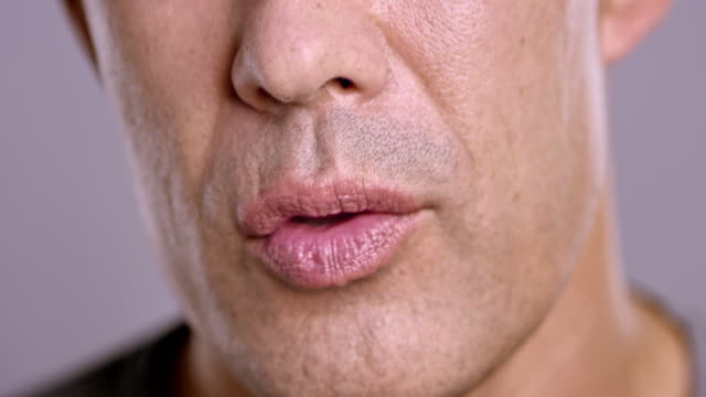 Lips of an Asian man talking