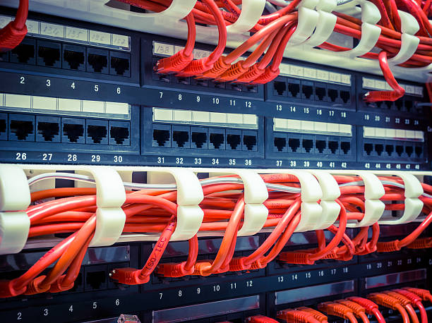 istock Close up of red network cables connected to switch 521198652