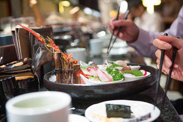 istock People eating japanese food 521199267