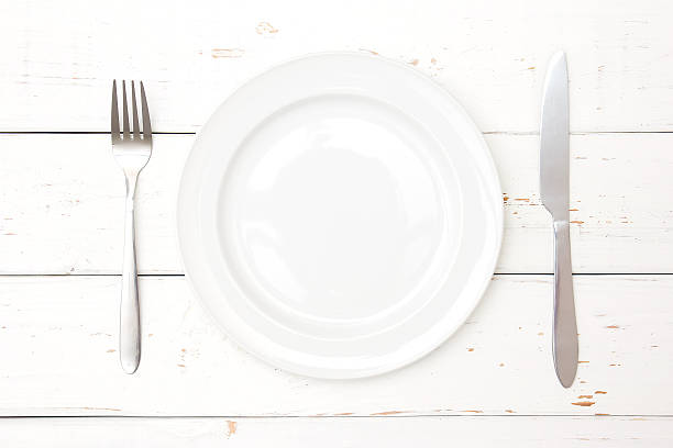 istock Top view of plate, fork and knife 521199362