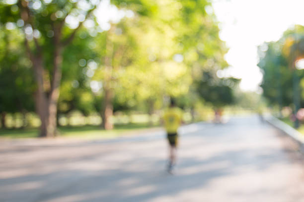 istock blurred backgrounds of people exercise at parks 521199460