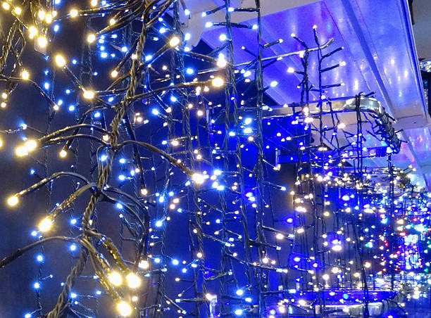 istock Image of defocused blue and white Christmas lights background, bokeh 521199695