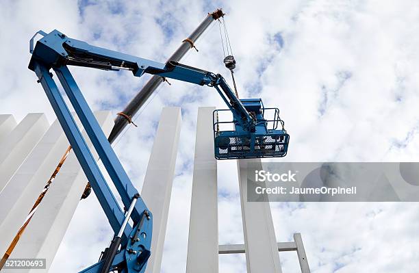 Building Under Construction Columns Cranes Stock Photo - Download Image Now - Mobile Crane, Bulldozer, Apartment