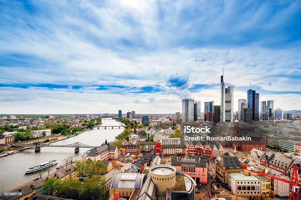 Panoramic view on Frankfurt skyline and Romerberg City Hall Square Panoramic view on Frankfurt skyline and Romerberg City Hall Square in Frankfurt in Germany. The Romerberg consists of old houses. Tourists nearby Frankfurt - Main Stock Photo
