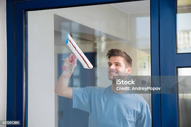 The Man Looks Outside Standing At The Open Window Of His Apartment Staying  At Home During The Epidemic And Quarantine Stock Photo - Download Image Now  - iStock