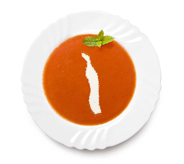 istock Plate with tomatosoup and cream (shape of Togo) 521202081