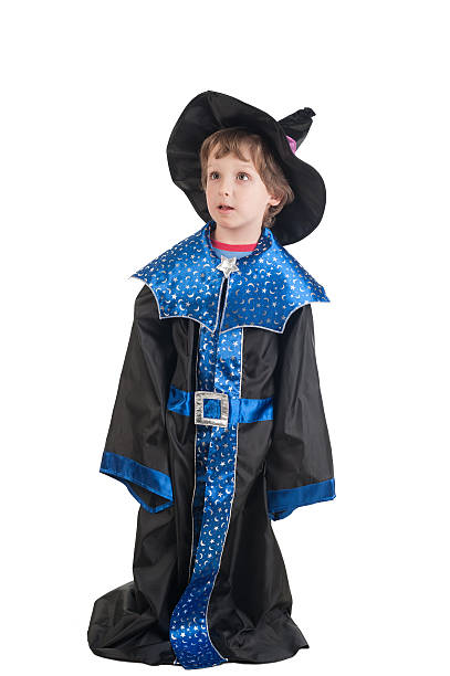 istock beautiful cute little boy in witch halloween costume 521202595
