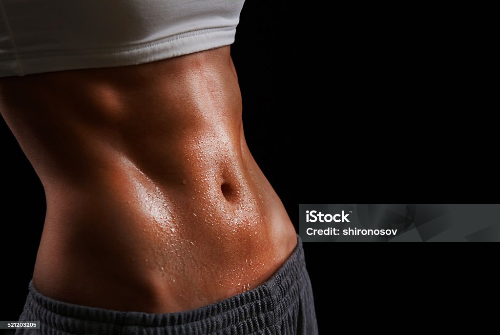 Sweating Wet torso of young sporty woman Women Stock Photo