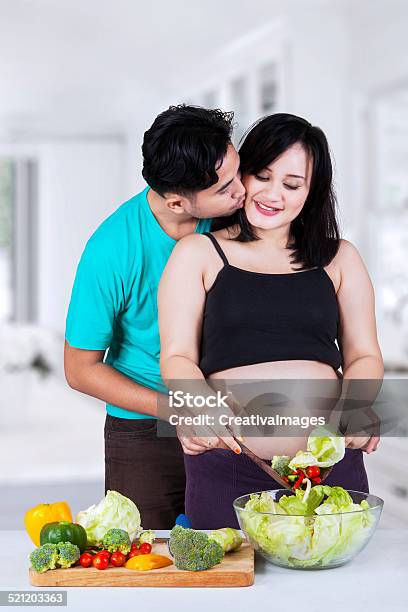 Man Kiss His Pregnant Wife Stock Photo - Download Image Now - Abdomen, Adult, Adults Only