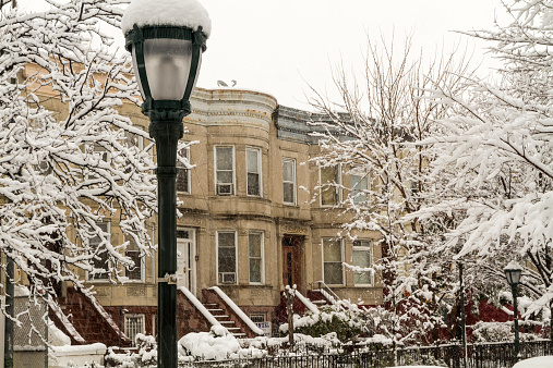 February 2014 snowstorm on the stoops of historic Brownstone apartments on Eastern Parkway in Crown Heights, Brooklyn