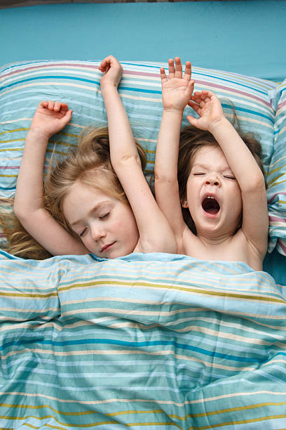 istock Two little girl wake up 521205956