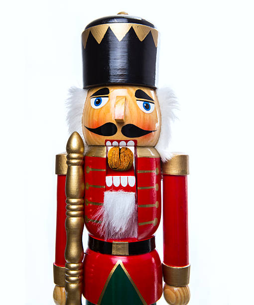 Traditional Christmas Nutcracker A classic Christmas Nutcracker cracking a walnut nutcracker photos stock pictures, royalty-free photos & images