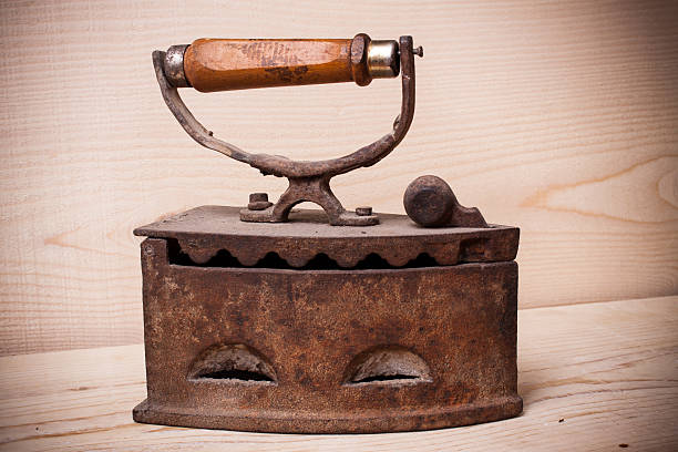 istock antique iron , Old iron , Old iron on wood wall 521206410