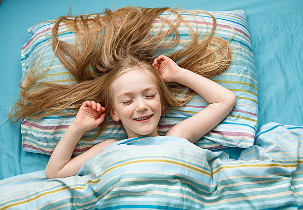 istock Little girl sleeps in the bed 521206676