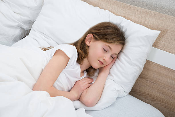 istock Girl Sleeping In Bed 521206686