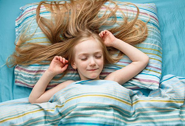 istock Little girl sleeps in the bed 521206736
