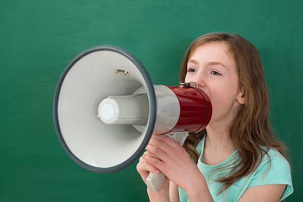 istock Girl Announcing On Megaphone 521206974