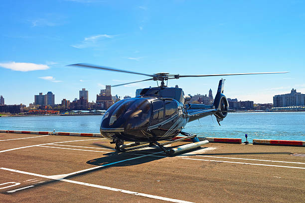 istock Black Helicopter on helipad in Lower Manhattan in New York 521207784