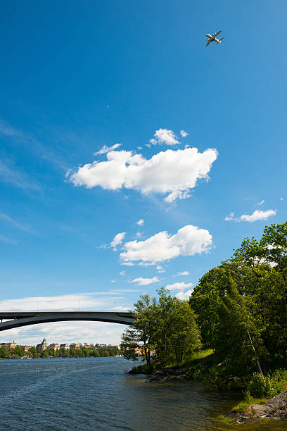 A plane descends over Stockholm, Sweden, soon to land at Bromma Airport. Photo taken from Långholmen, one of the islands in Stockholm.