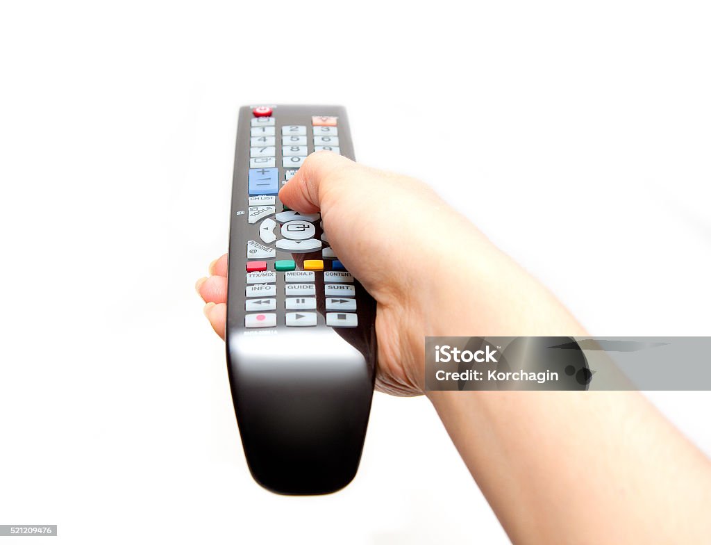 Black TV remote in hand black TV remote in hand isolated on white background Remote Control Stock Photo