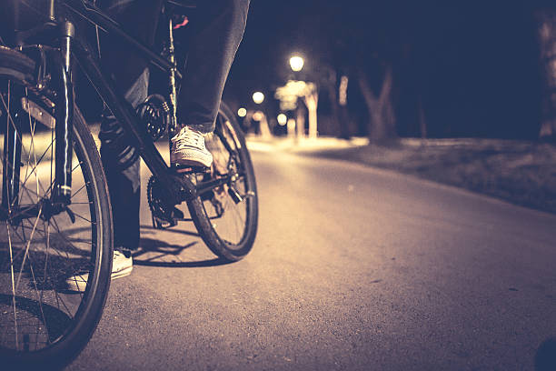 istock Man rides a bicycle in the park 521211240