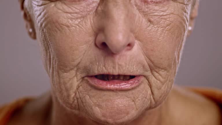 Lips of an angry senior Caucasian woman