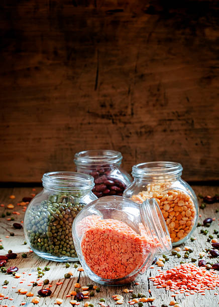 istock Red lentils in a glass jar, bean mix 521221938