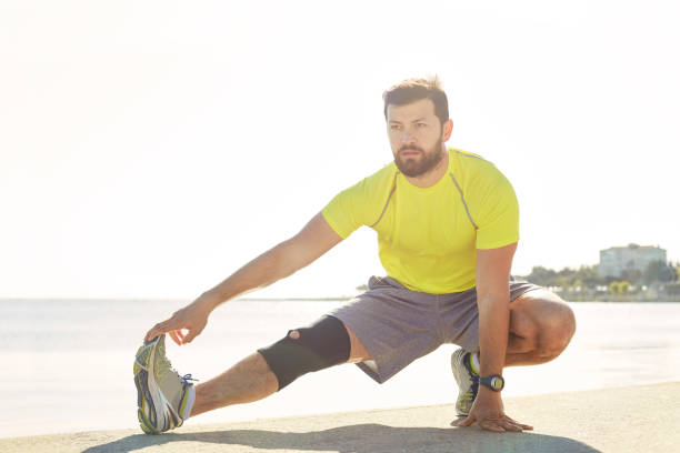 istock Photo of a Man Stretching in the Sun 521222896
