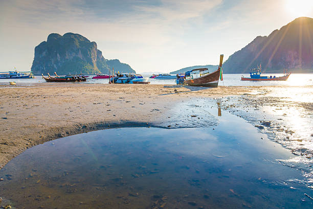 istock Beach and tropical sea with long-tail boat in thailand 521223582