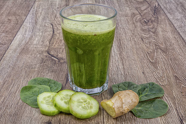 istock Blended smoothie with ingredients on wooden table 521224056